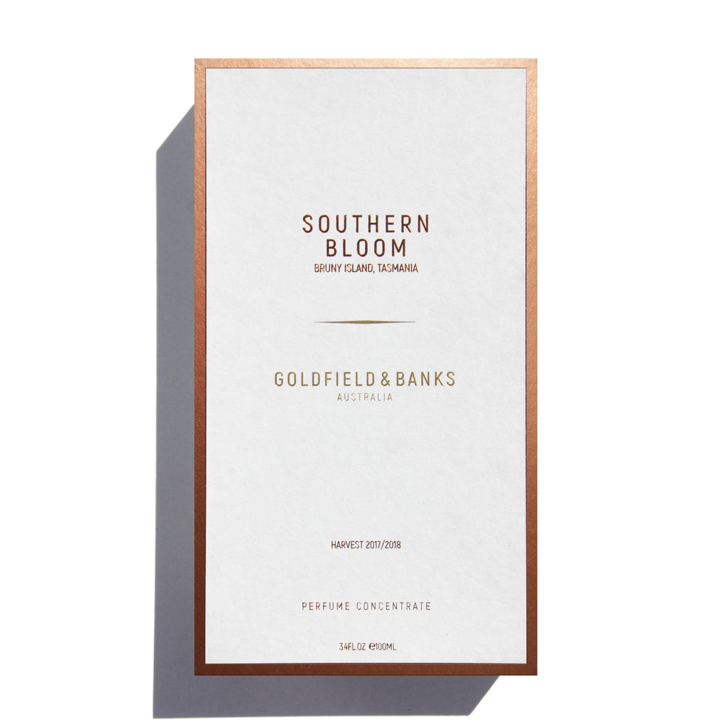 Here's a revised version of the sentence using the given product data:

"A perfume box labeled 'Southern Bloom' by Goldfield & Banks highlights 'Harvest 2017/2018' and flaunts the luxurious fragrance of Boronia Absolute. The packaging indicates 'Perfume Concentrate, 3.4 FL.OZ., 100 ML.'