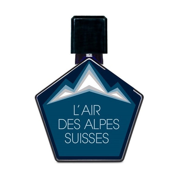 Hexagonal bottle with a dark cap, labeled "L'Air Des Alpes Suisses" by Tauer Perfumes in white text. The label features an illustration of Swiss mountains and highlights the scent's blend of alpine herbs.