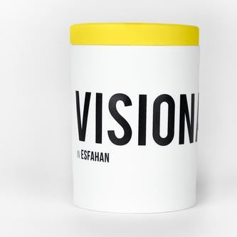 White candle jar with yellow top band and VISION text on label