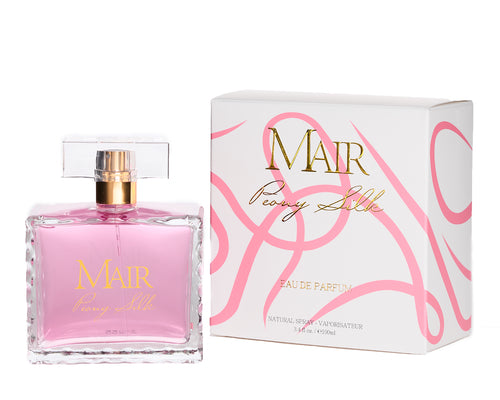 A clear glass bottle of pink perfume labeled "Mair Peony Silk" sits next to its matching white and pink box, showcasing a beautiful fragrance release with notes of delicate florals.