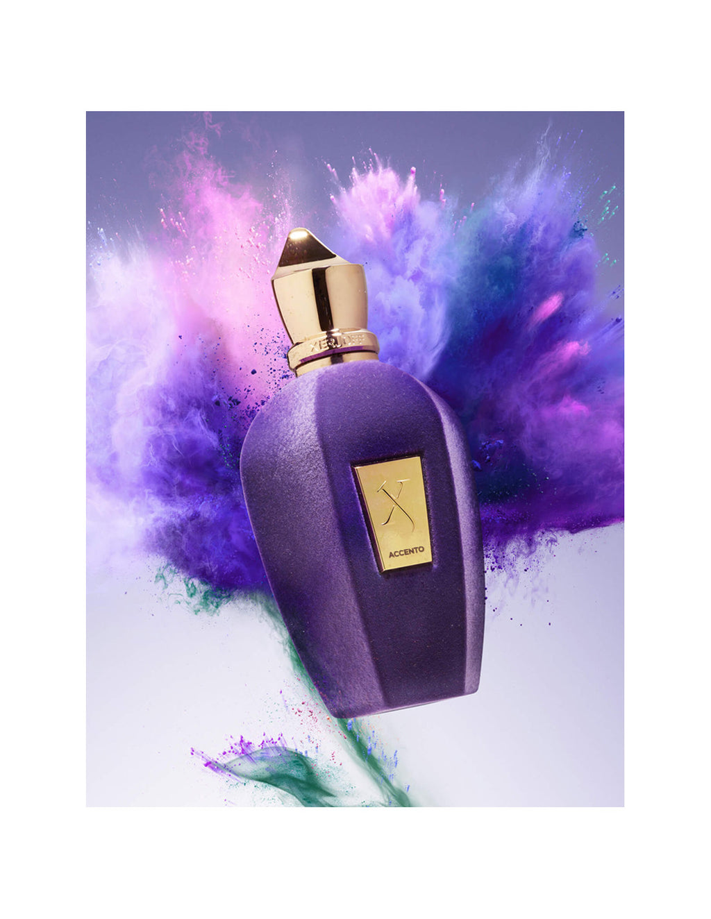 A purple perfume bottle with a gold cap and label, surrounded by vibrant purple and green powder bursts, floating against a light background. The label reads "Accento" and "Xerjoff." This exquisite piece of pure luxury, Accento Xerjoff, is imbued with a delightful fruity scent.