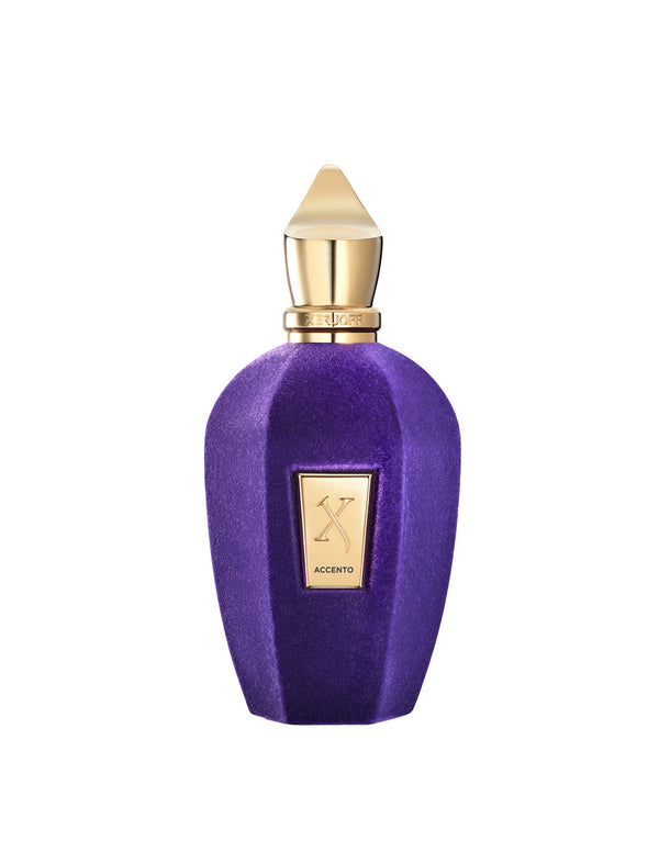 A purple and gold perfume bottle labeled "Accento" by Xerjoff boasts a gold cap and a geometric design, epitomizing pure luxury with its fruity scent.