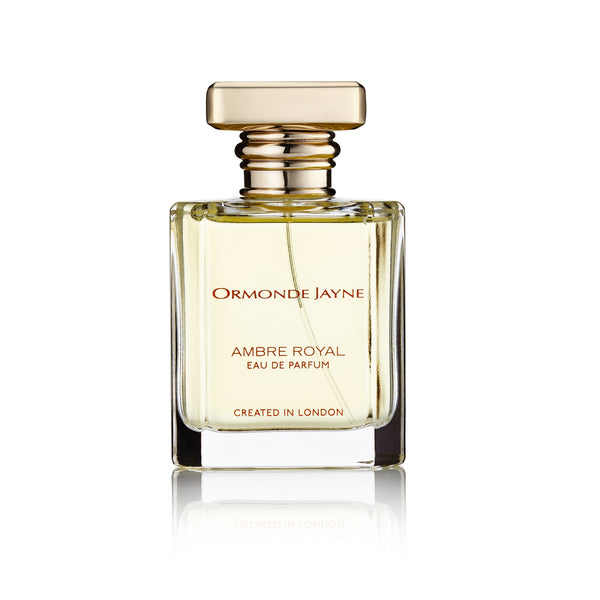A bottle of Ormonde Jayne Ambre Royal perfume, featuring a square glass design, a golden cap, and text indicating it was created in London. Hints of jasmine and patchouli subtly enrich its luxurious fragrance.