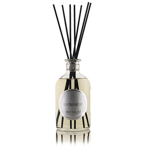 Glass reed diffuser bottle with chrome cap and black reeds, Kathmandu Nicolai label