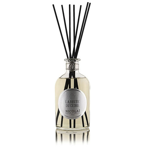 La Route Du Cedre reed diffuser in clear glass bottle with black reeds and silver cap