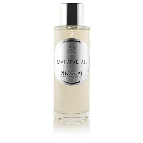 Maharadjah room spray bottle with clear glass and black cap, cream label