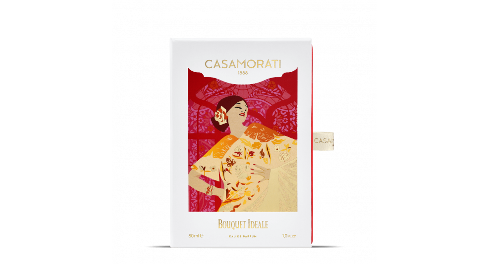 A bottle of Bouquet Ideale by Casamorati, 30 ml, with a stylized design of a woman in traditional attire and floral patterns on the packaging, captures the essence of Italian perfumery while exuding a vintage scent.