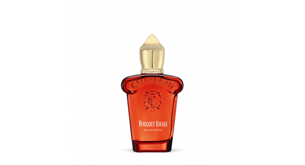 A red perfume bottle with a gold cap, labeled "Casamorati" and "Bouquet Ideale," embodies the luxurious allure of Italian perfumery with its spicy oriental fragrance.