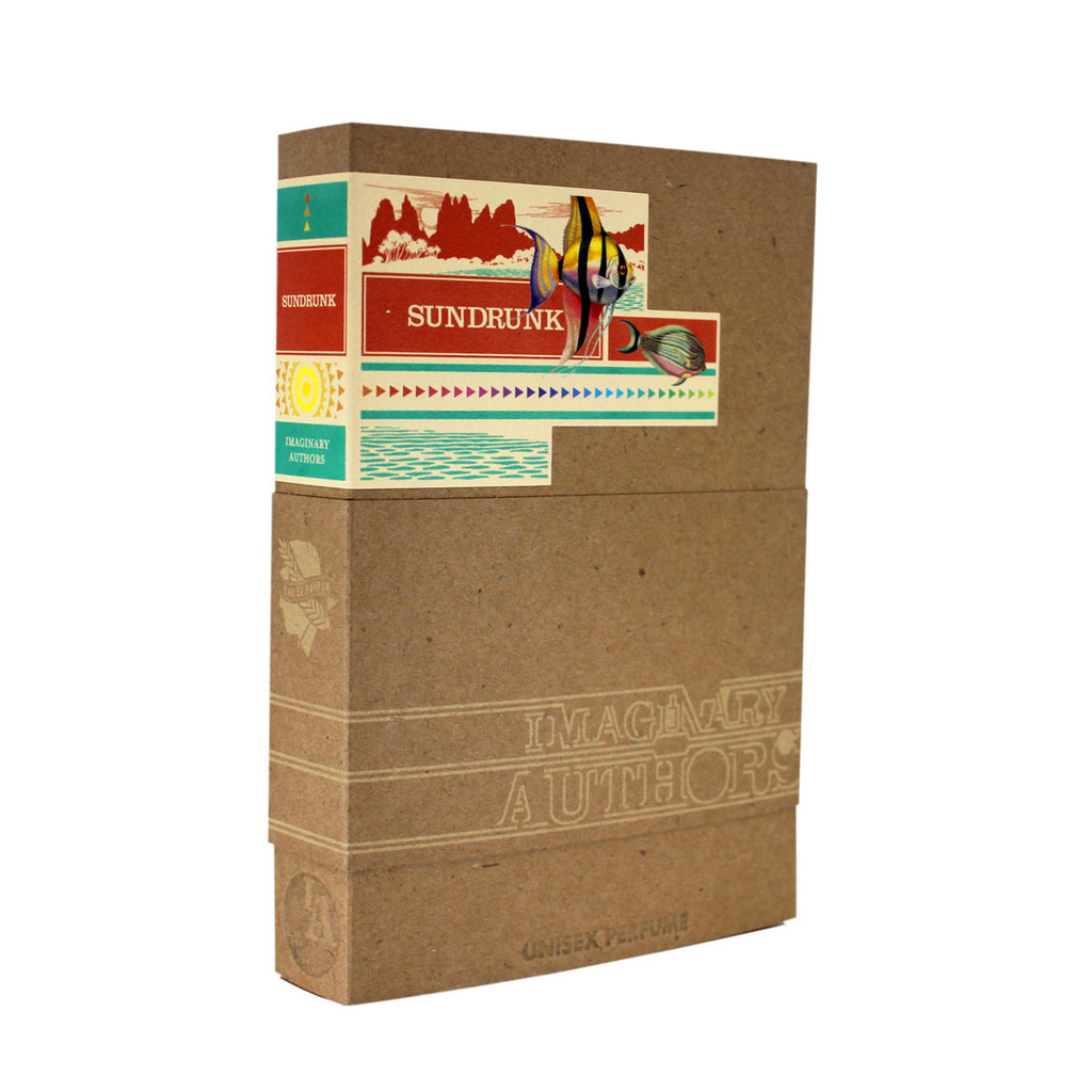 A boxed perfume named "Sundrunk" by Imaginary Authors, featuring colorful graphics and text on the packaging. The box boasts a brown and tan design with embossed writing and decorative elements, suggesting hints of neroli and rhubarb.