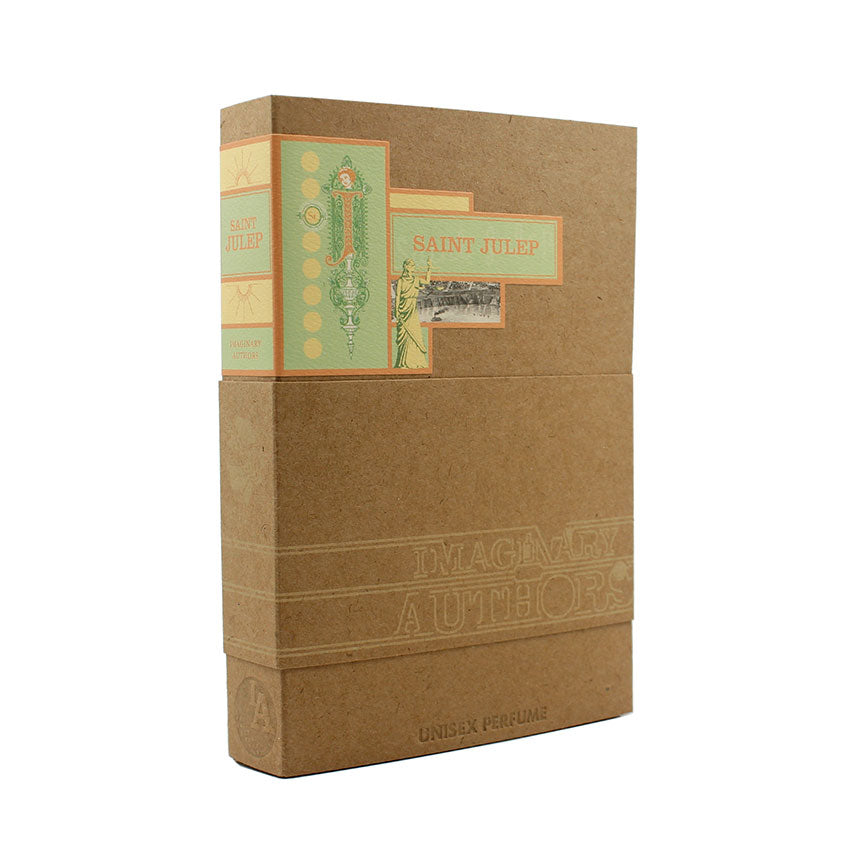 A boxed bottle of "Saint Julep" by Imaginary Authors, a unisex perfume characterized by packaging adorned with light green and beige designs, exuding decorative elements that evoke the essence of sweet mint and Southern magnolia.