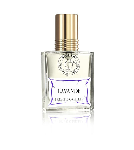Clear glass lavender linen spray bottle with gold cap; label reads Lavande