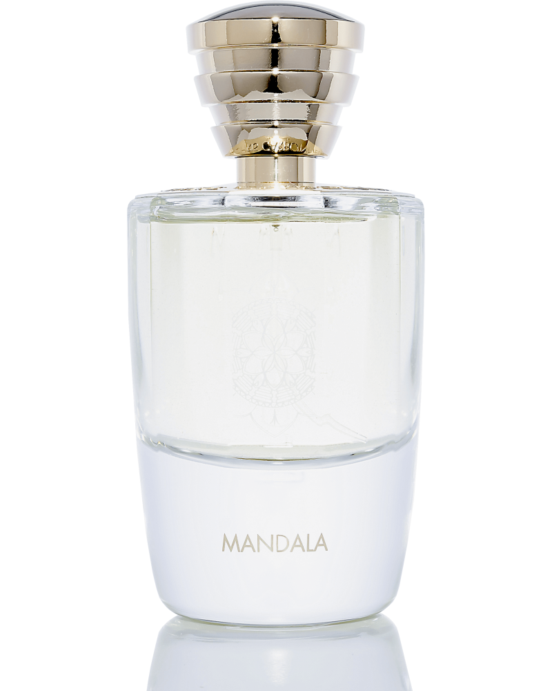 A clear glass perfume bottle with a gold-colored cap, labeled "Mandala" on the front, exudes the myrrh and incense fragrance characteristic of Masque Milano.