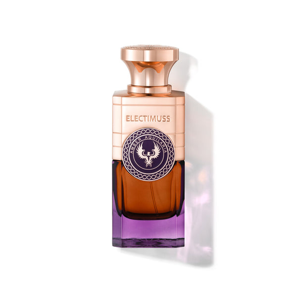 Bottle of Amber Aquilaria by Electimuss with a purple base and gold detailing, perfect for the discerning fragrance connoisseur.