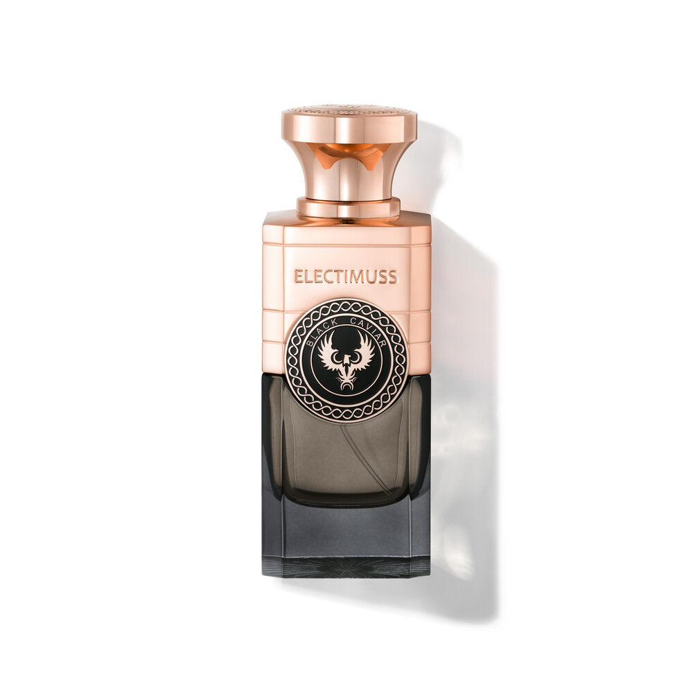 A square-shaped perfume bottle with a gold-colored cap and a label reading "Electimuss." The bottle is half gold and half dark shaded, featuring an ornate circular design with a central emblem. This luxury fragrance, Black Caviar by Electimuss, exudes sophistication, making it perfect for those who appreciate the finer things.