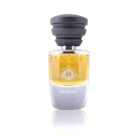 A glass bottle of Mandala perfume with a black cap, containing amber-colored liquid. The label showcases a mandala design, and the brand name, Masque Milano, is prominently displayed at the top. Crafted by Christian Carbonnel Perfumeur, it exudes a myrrh and incense fragrance.