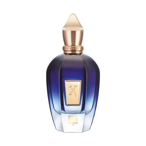 A blue and gold perfume bottle labeled "More Than Words" by Xerjoff, adorned with a geometric gold cap and an elegant gold label featuring an ornate "X" design. This sophisticated bottle houses a fragrance enveloped in oriental woods and oud notes.