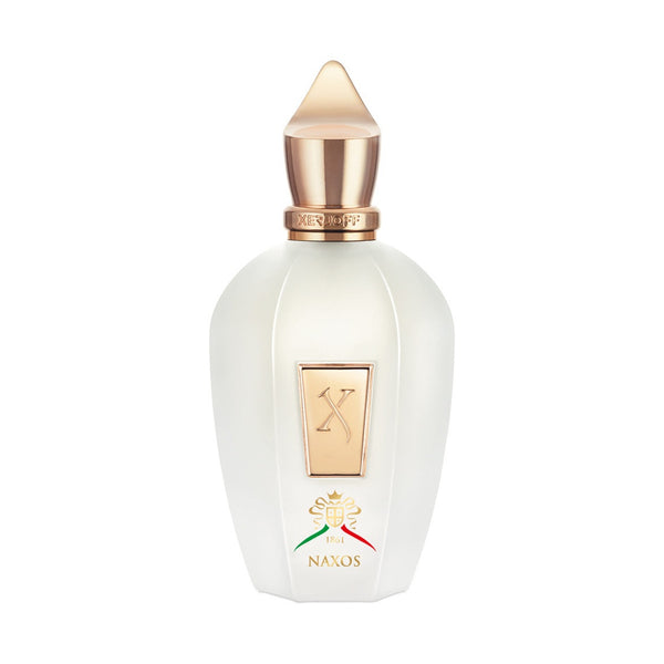 A white Xerjoff Naxos perfume bottle adorned with a gold cap and label, featuring the word "Naxos" and an ornate logo at the bottom, beautifully captures the vibrant essence of Sicily with notes of Mediterranean citruses.