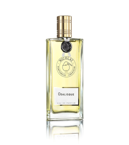 Odalisque Eau de Parfum bottle, clear glass with gold cap, yellow liquid