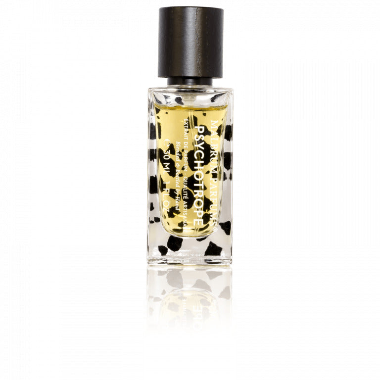 A bottle of Malbrum Parfums Psychotrope perfume with a black cap and text on the front, featuring a white and black spotted design. The scent combines notes of amber and sandalwood, creating an alluring aroma that captivates the senses.