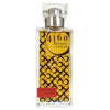 Clear perfume bottle with metallic silver cap and gold circular label