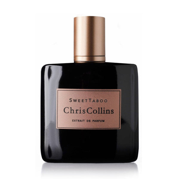 Perfume bottle with black glass, gold cap, and Sweet Taboo Chris Collins label