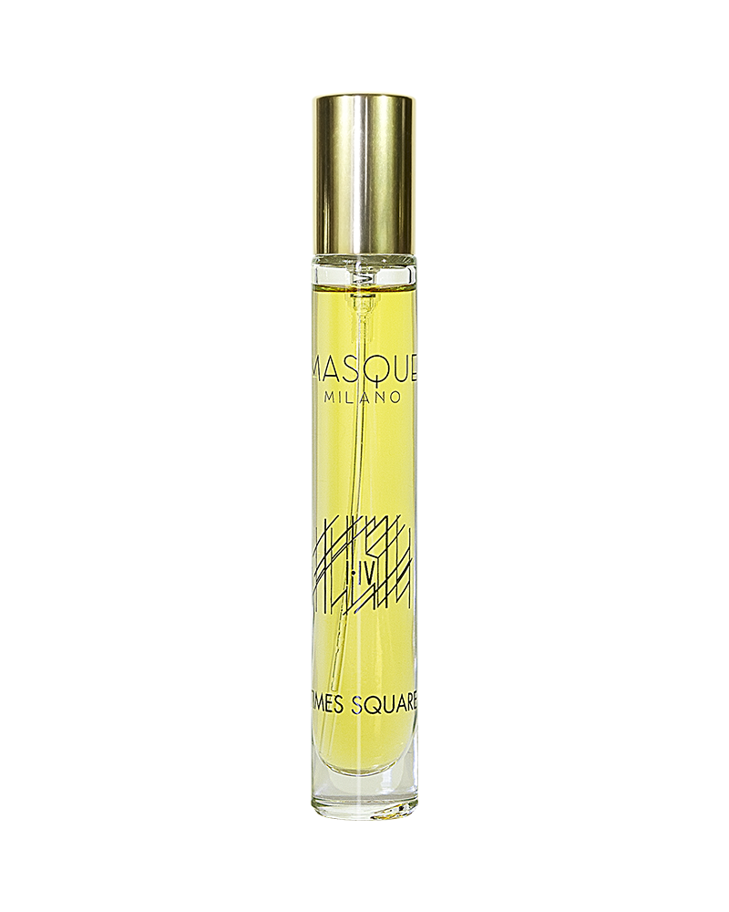 A clear glass bottle filled with yellow liquid, labeled "Times Square" by Masque Milano, featuring a gold cap, encapsulates the vibrant essence of New York in an exquisite perfume.