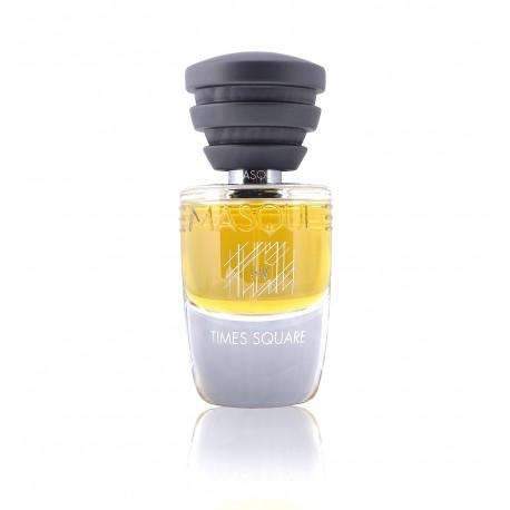 A glass bottle of Masque Milano "Times Square" fragrance exudes the vibrant energy of New York, featuring a sleek black stepped cap and captivating yellow liquid. The label prominently showcases the Masque Milano brand and "Times Square" product name, encapsulating the essence of city miasmas in a sophisticated perfume.