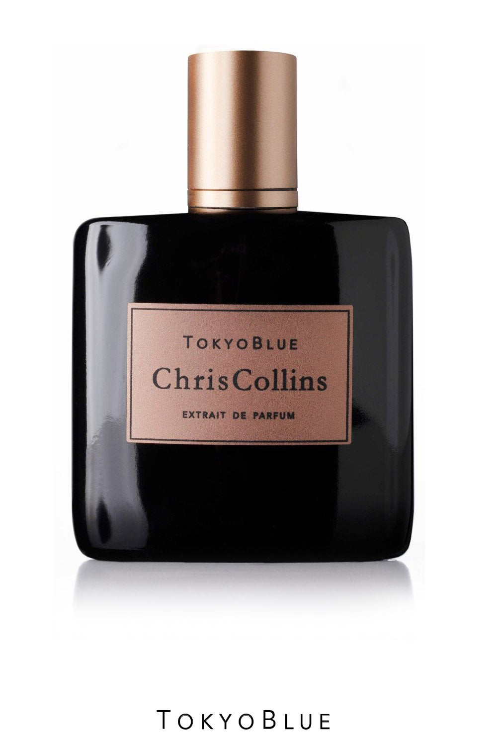 A bottle of Tokyo Blue by Chris Collins, featuring a black exterior with a gold label, exudes a masculine floral fragrance and is part of the Dark Romance Collection.