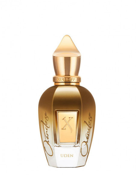 A gold and clear glass perfume bottle with a pointed cap, featuring the brand name "Xerjoff" and the label "Uden Overdose" on the front. The word "Overdose" is inscribed along the sides, marking this as an exceptional fougère fragrance.