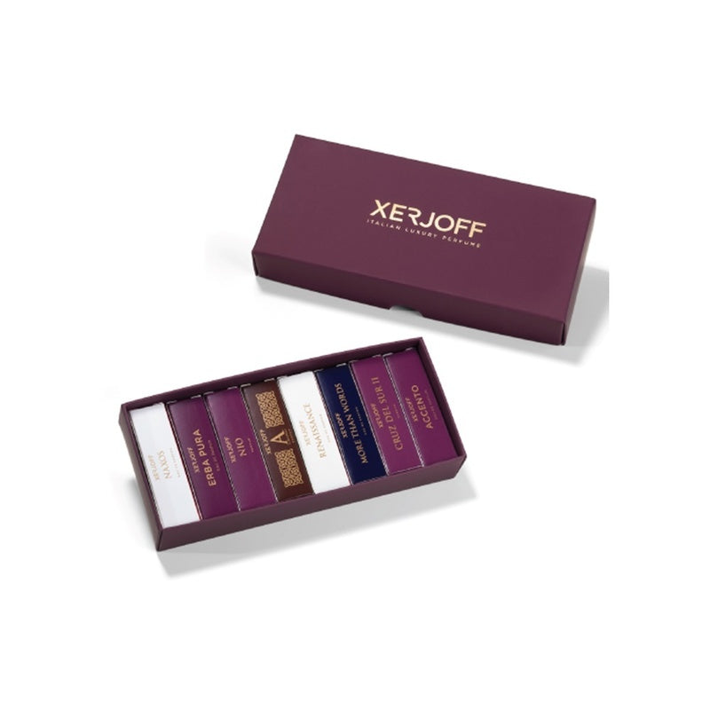 A purple Xerjoff Best Seller Discovery Set 7 x 2ml gift box contains seven assorted perfume samples arranged in individual compartments, with the lid placed sideways next to the box.